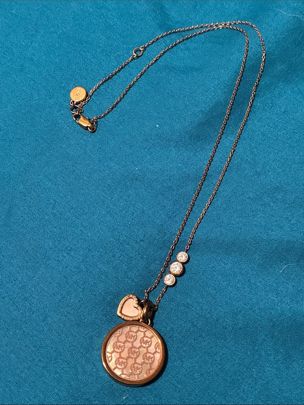 Michael Kors Rose Tone Logo Disc Necklace with Heart Charm
